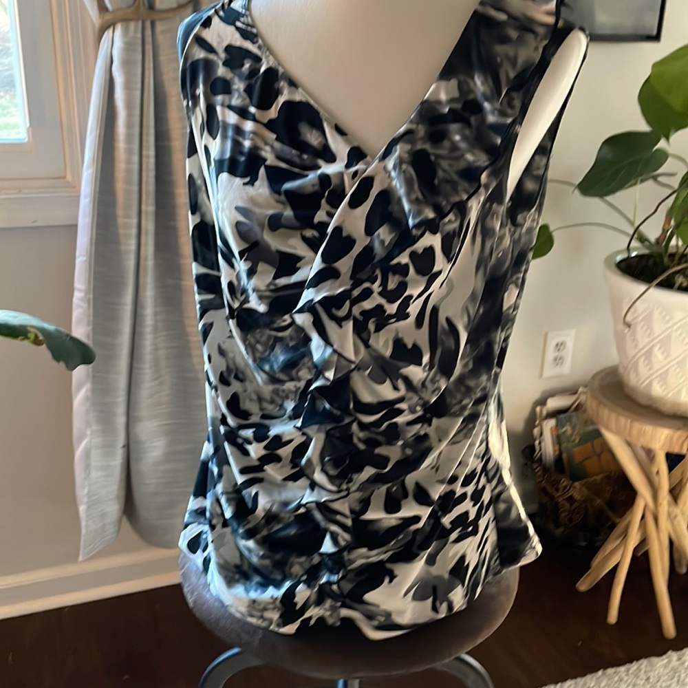 Milano sleeveless top with ruffle detail.